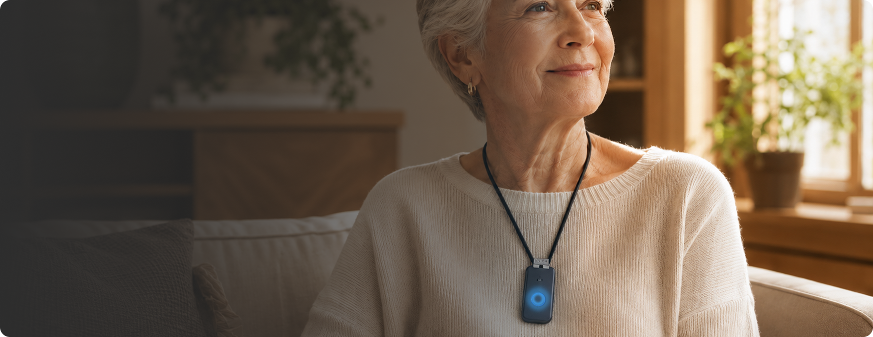 Senior wearing a Medical Life Club pendant, relaxing at home